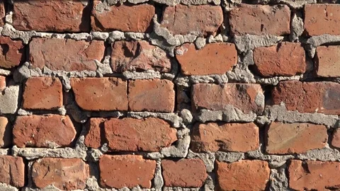 Red brick wall video sunny day. High Quality Texture Background Footage Stock Footage 240857773