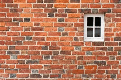 Red brick wall with window Stock Photos