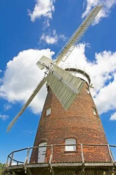 Red brick windmill with rotating top Stock Photos