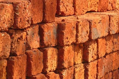 Red Bricks Background A background of a stack of red bricks at a construct... Stock Photos
