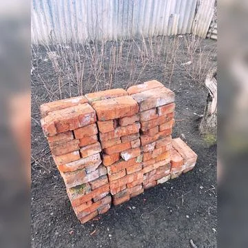 Red bricks broken by time waiting for their time Stock Photos