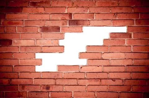 Red bricks broken wall and chuckhole background Foto stock