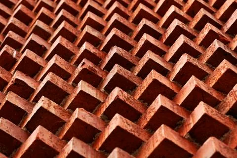 Red bricks forming patterns on a facade in the center of Umea Stock Photos
