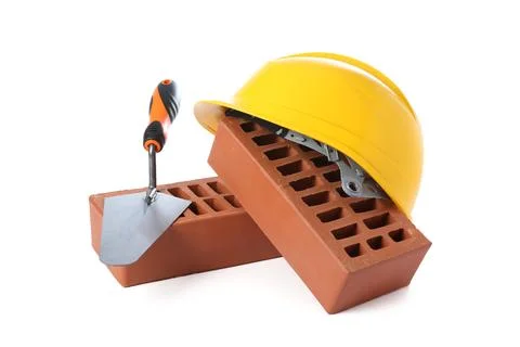 Red bricks, hard hat and trowel on white background Stock Photos