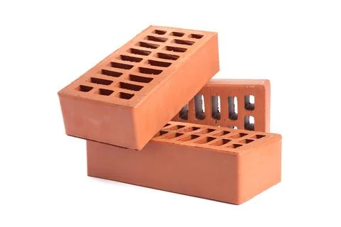 Red bricks isolated on white. Building material Fotos de archivo