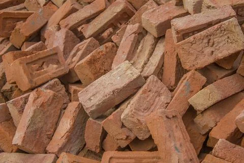 Red bricks lie in a pile Stock Photos