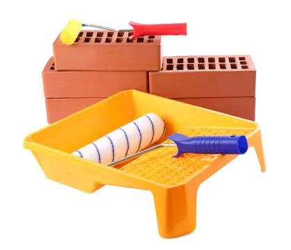 Red bricks, rollers and tray isolated on white. Building material and const.. Stock Photos