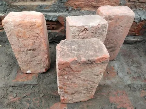 Red bricks stacked at a construction site, close-up. The bare brick walls o.. 写真素材