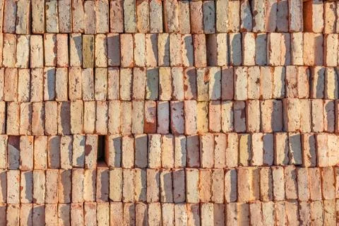 Red bricks stacked on top of each other. Background for construction. Stockfoto's