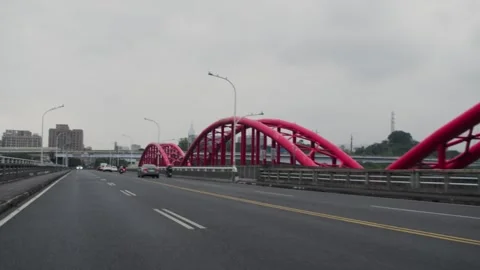 Red Bridge Entry POV Scooter and Car Ride Asia(Taipei City, Taiwan)(2025.03.30) Stock Footage 306544339