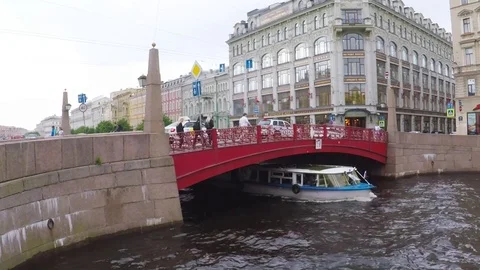 Red Bridge over river Moika in  St -Petersburg of Russia. Stock Footage 79774346