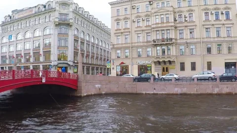 Red Bridge over river Moika in  St -Petersburg of Russia. Stock Footage 79774388