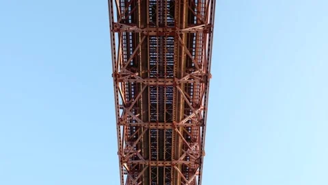 Red bridge shot from bellow with passing cars Stock Footage 140460098