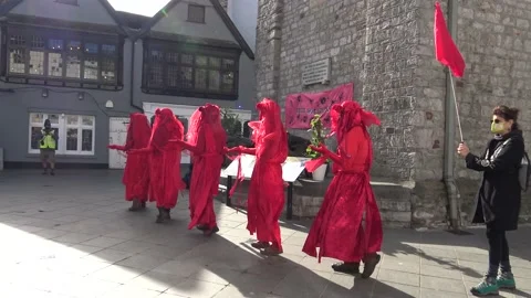 Red Brigade take part in Extinction Rebellion Climate Protest in Town Centre Stock Footage 140875656
