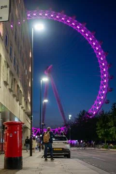 Red British Post Box next to County Hall Apartments with the London Eye Stock Photos