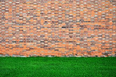 Red brown brick wall texture grunge background, green grass, interior design Stock Photos