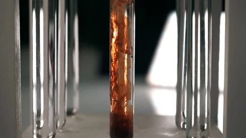 Red-brown ink drop in water, drop color mixture falls on water. Slow motion Stock Footage 188749361