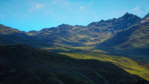 Red-brown slopes and snow-capped mountain peaks Stock Footage 237604679