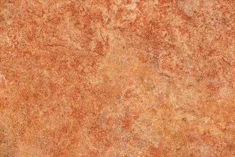 Red-brown surface with light marbling like stone 스톡 사진