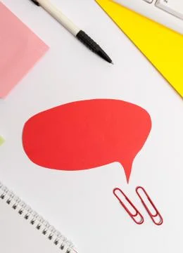 Red bubble copy space paper on the table with clock. Business concept with empty Foto stock