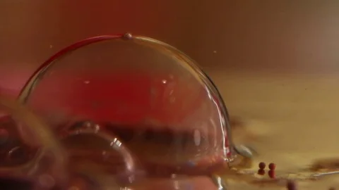 Red Bubble Pops Slo-Mo Stock Footage 75559467