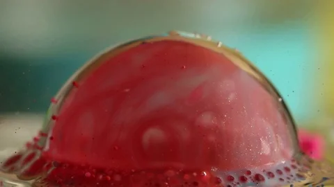Red Bubble Pops Slow Motion Stock Footage 75556558