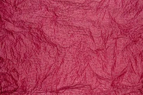 Red bubble wrap texture surface with glossy circular raised pattern Stock Photos