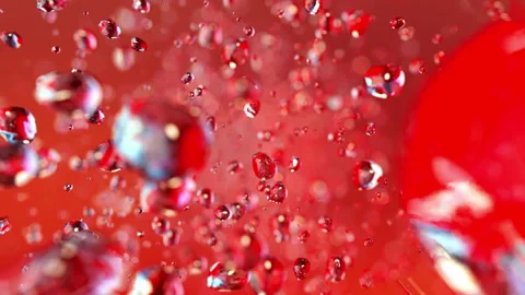 Red bubbles flying in super slow motion 4K Stock Footage 150428031