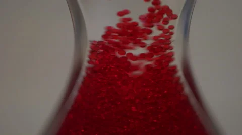 Red Bubbles moving upwards through hourglass Stock Footage 51471016