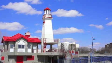 Red Building and Lighthouse Stock Footage 22879406