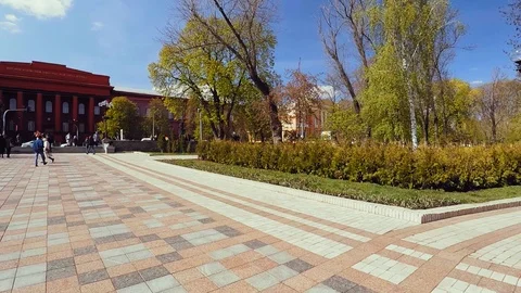The red building in classical style with a colonnade, which rests against a park Stock Footage 102527770