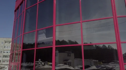Red building with tinted glass windows Stock Footage 74346026