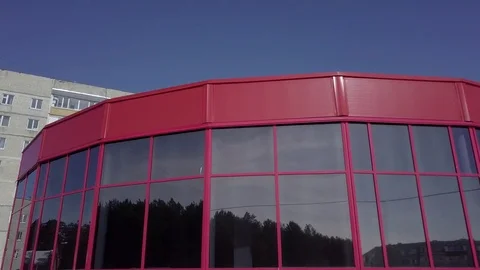 Red building with tinted glass windows Stock Footage