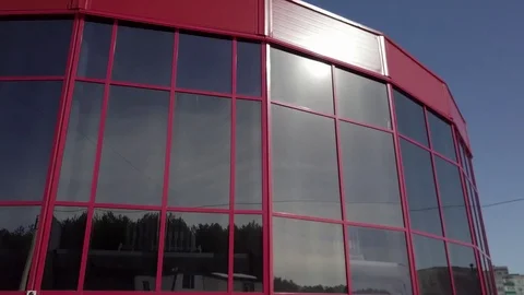Red building with tinted glass windows Stock Footage