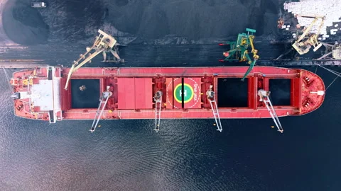 Red bulker for transportation of unpackaged raw commodities. Top view on the Stock Footage 340128688