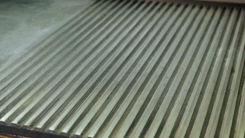 Red bun. Two halves of hamburger bread are being fried on a grill for burger. 4K 库存影片 98024600