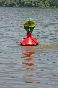 Red buoy floating in the river Stock Photos
