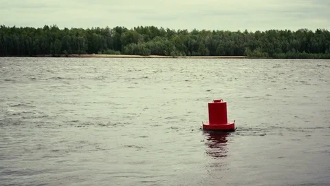 Red buoy on the water Stock Footage 76519139