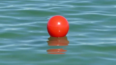 Red buoy with waves floating in water, Travemuende, Schleswig-Holstein, Germa Stock Footage 158910181