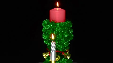 A red burning candle between two small burning candles Stock Footage 201930405