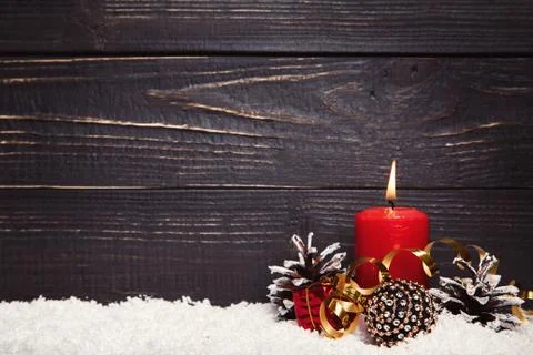 Red burning candle with black rustic wooden board Stock Photos