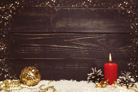 Red burning candle with black rustic wooden board Stock Photos