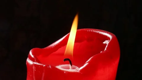 Red burning candle with wick and dark background, Germany Stock Footage 305149862