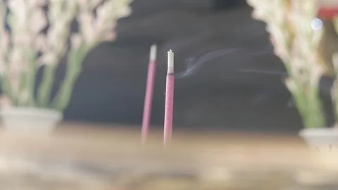 A red burning incense Stock Photos