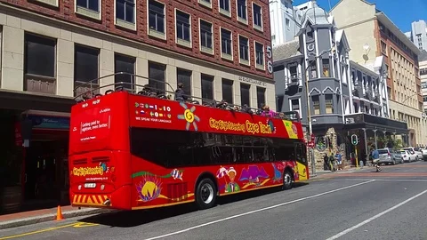 Red bus in long street Stock Footage 112921453