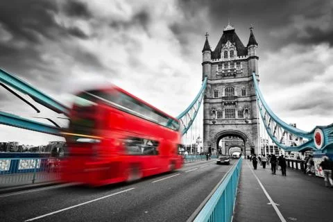Red bus in motion on Tower Bridge in London, the UK Stock Photos