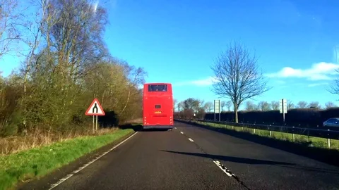 Red bus on the road Stock Footage 76953280