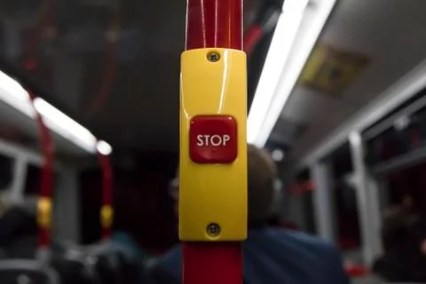 Red bus stop button on a double decker bus 写真素材