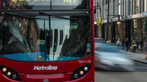 Red buses and black London taxis on a busy road in London Stock Footage 41914341