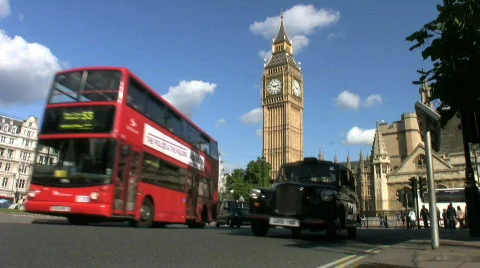 Red buses cabs. London bus and black taxi cab Big Ben and Houses of Parliament. Stock Footage